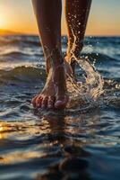 a person walking in the ocean at sunset photo