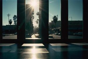 a view of the sun shining through the windows of a building photo