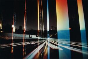 a photograph of a city street at night with a long exposure photo