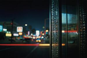 a view of the city at night from a window photo