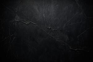 an empty room with a black wall and wooden floor photo