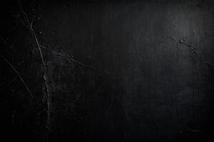 an empty room with a black wall and wooden floor photo