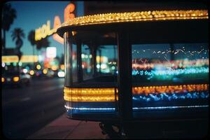 a bus with lights on the side of it at night photo