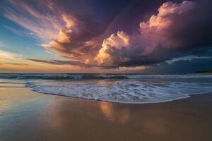 a rainbow is seen over the ocean as it is reflected in the water photo