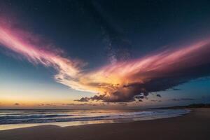 a colorful sunset over the ocean and beach photo