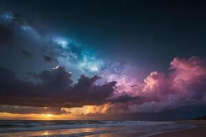 a colorful sunset over the ocean and beach photo