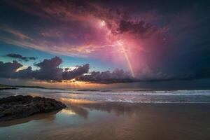 a colorful sunset over the ocean and beach photo