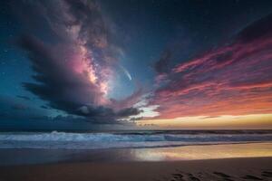 a rainbow is seen over the ocean at night photo