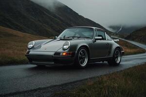 a silver porsche 911 parked on the side of the road photo