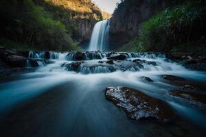 AI generated waterfall in the jungle at sunset photo