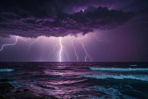 lightning strikes the ocean against a purple sky photo