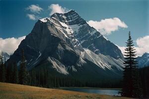 a mountain range with trees and mountains in the background photo