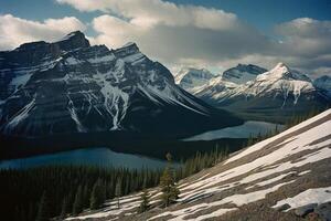 a mountain range with trees and mountains in the background photo