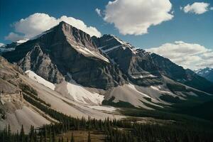 a mountain range with trees and mountains in the background photo