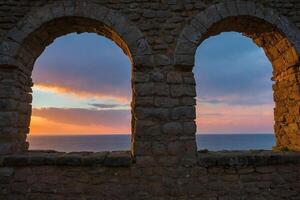 sunset view from the castle of santorini photo