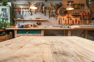 Empty wooden table in the foreground and blurred background with carpenter's tools on the wall. . photo