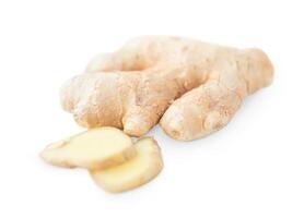Whole ginger and it's slices in front of it isolated on white background photo