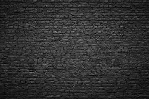 gloomy background, black brick wall of dark stone texture photo