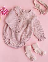 Set of pink clothes and accessories for newborn baby. photo