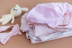 Stack of Baby bodysuits. photo