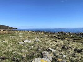 A view of the Isle of Arran in Scotland on a sunny day photo