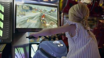 Girl playing arcade motorcycle game video