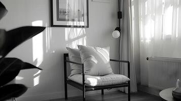 Bright Minimalist Living Space with Monochrome Pillow Covers and a Well-Lit Scandinavian-Style Armchair photo