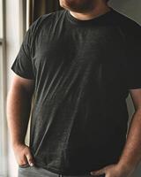 Big size fat adult man model in Blank black T Shirt for design mockup photo