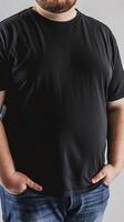 Big size fat adult man model in Blank black T Shirt for design mockup photo