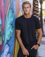 Young Caucasian Adult in Blank Black T Shirt photo