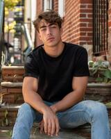 Young Caucasian Adult in Blank Black T Shirt photo