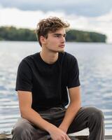 Young Caucasian Adult in Blank Black T Shirt photo