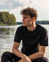 Young Caucasian Adult in Blank Black T Shirt photo