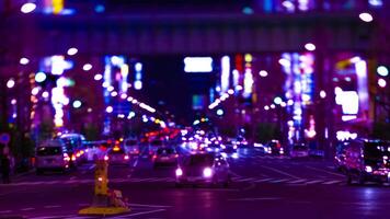 A night timelapse of the neon street at the downtown in Akihabara Tokyo long shot tilt video