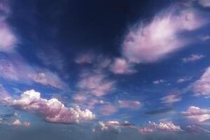 cirrus and cumulus reverse on a blue sky background on a sunny summer day in good weather photo