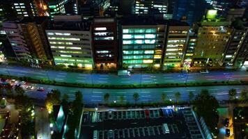 A night timelapse of street at the urban city in Tokyo wide shot tilt video