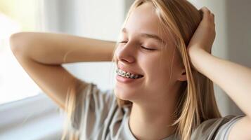 braces on teeth Beautiful red lips and white teeth with metal braces. A girl's smile. photo