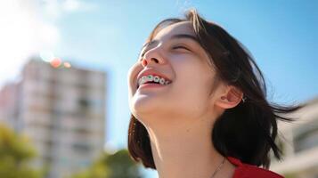 braces on teeth Beautiful red lips and white teeth with metal braces. A girl's smile. photo