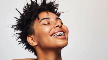 braces on teeth Beautiful red lips and white teeth with metal braces. A girl's smile. photo