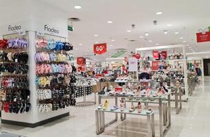 Bekasi, Indonesia on December 20 2023. Various types of shoes and sandals at the Matahari Mall store. photo