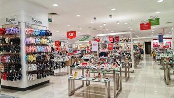 Bekasi, Indonesia on December 20 2023. Various types of shoes and sandals at the Matahari Mall store. photo