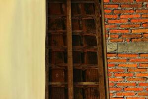 Clay roof tiles and rafters from a house tile in the village. photo