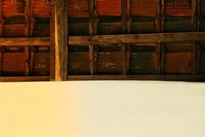 Clay roof tiles and rafters from a house tile in the village. photo