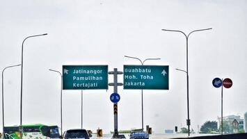 Bandung, Indonesia on December 20, 2023. A butterfly sign at the toll road intersection towards Jatinangor Pamulihan Kertajati and Buah Batu Moh Toha Jakarta. photo