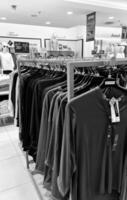 Bekasi, Indonesia on December 20, 2023. Rows of hangers with the words several women's clothes hanging on them. photo