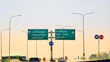 Bandung, Indonesia on December 20, 2023. A butterfly sign at the toll road intersection towards Jatinangor Pamulihan Kertajati and Buah Batu Moh Toha Jakarta. photo