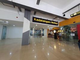 Jakarta, Indonesia on July 7 2022. The atmosphere from the exit of the Arrival section of Halim Perdanakusuma Airport, you can see passengers entering and officers standing guard. photo