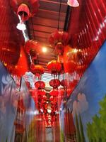 Bangkok, Thailand on July 22, 2023. The interior of the Wat Mangkon Kamalawat temple filled with red lanterns. photo