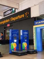 Jakarta, Indonesia on July 7 2022. The atmosphere from the departure entrance of Halim Perdanakusuma Airport, visible to passengers entering and officers on guard. There is also a self check for the photo