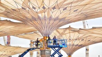 Medina, Saudi Arabia on March 1 2024. Repairs to the Nabawi Mosque umbrella were carried out by technicians with the help of a manlift. Regular repairs, checks and maintenance photo